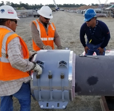 Rilco Team Member Instructing on PyroWrap Pipe Support Installation